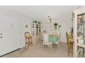 Bright dining room with table, chairs, and hutch at 756 White Pine Tree Rd # 211, Venice, FL 34285