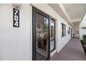 Condo building entryway with black door and number 784 at 784 Bird Bay Way # 105, Venice, FL 34285