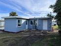 Rear view of newly renovated light blue house at 8500 Agress Ave, North Port, FL 34287