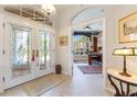 Bright and spacious entryway with glass doors and views to an office at 1010 Grouse Way, Venice, FL 34285
