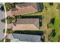 Aerial perspective showcasing a home's roofline and backyard at 12861 Oriago St, Venice, FL 34293