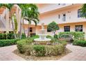 Peaceful courtyard with fountain and seating area at 1602 Gondola Park Dr # 1602, Venice, FL 34292