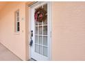 Condo front door with a decorative wreath at 1602 Gondola Park Dr # 1602, Venice, FL 34292