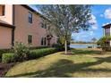 Landscaped yard with lake view at 23499 Awabuki Dr # 102, Venice, FL 34293