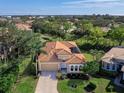 Single-Gathering home with a tile roof in a residential neighborhood at 249 Rio Terra, Venice, FL 34285