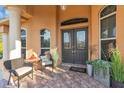 Covered entry with double doors and welcoming seating area at 3162 Cordova Ter, North Port, FL 34291