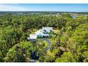 Stunning property nestled within a dense forest, offering a serene and secluded living environment at 340 N River Rd, Venice, FL 34293