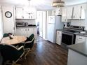 Bright kitchen features modern appliances and a dining area at 426 Boxwood Dr, Venice, FL 34285