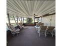 Bright Florida room with seating area and ceiling fan at 451 Home Park Rd, Venice, FL 34285