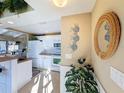 Bright white kitchen with island and stainless steel appliances at 500 Park S Blvd # 7, Venice, FL 34285