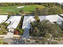 Aerial view of a well maintained single-Gathering home near a golf course and mature landscaping at 522 Fallbrook Dr, Venice, FL 34292