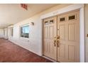 Condo building entrance with tiled flooring and access to unit 401 at 550 W Flamingo # 401, Venice, FL 34285