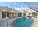 Relaxing screened-in pool with ample deck space at 5891 Madison Rd, Venice, FL 34293