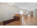 Bright entryway with double doors, hardwood floors, and a view to the dining area at 740 Citrus Rd, Venice, FL 34293