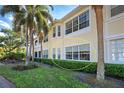 Building exterior showcasing a window and lush landscaping at 804 Triano Cir # 804, Venice, FL 34292