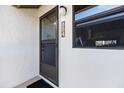 Inviting front entrance featuring house number, storm door, and decorative window, offering curb appeal at 854 Bird Bay Way # 190, Venice, FL 34285