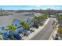 Aerial perspective of townhouses showcasing a tranquil neighborhood setting at 8634 Palmer Park Cir, Sarasota, FL 34238