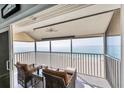 Spacious balcony with ocean view, featuring comfortable seating at 1000 Tarpon Center Dr # 601, Venice, FL 34285