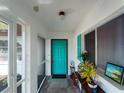 Welcoming Foyer featuring bright shutters and a colorful front door, creating a warm and inviting ambiance at 1212 Mango Ave, Venice, FL 34285