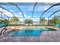 Enclosed pool and spa area with lake view at 13376 Caravaggio Ct, Venice, FL 34293