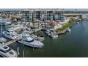 Waterfront condo building featuring a private marina with multiple boat slips and easy access to the open water at 501 Tamiami N Trl # 502, Venice, FL 34285