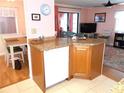 Kitchen island with dishwasher and granite top at 562 Longwood Dr, Venice, FL 34285