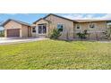 A beautifully landscaped front yard complements this well-maintained single-story home at 5694 Hale Rd, Venice, FL 34293