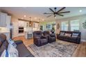 Open concept living room with kitchen and recessed lighting at 600 Nasturtium Ct, Nokomis, FL 34275