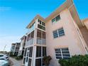 A close exterior view of the condos with screened patios, windows, and exterior paint scheme at 200 The Esplanade N # B10, Venice, FL 34285