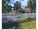 Backyard featuring a white picket fence providing a secure and private outdoor space at 2863 Twinkle Ave, North Port, FL 34286
