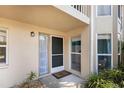 This condo's front entrance features a large, clean front door, a tile entryway and updated windows at 811 Waterside Dr # 102, Venice, FL 34285