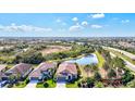 Aerial view of single Gathering home with view of the lake and green landscape at 351 Carlino Dr, Nokomis, FL 34275