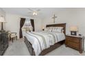 Cozy bedroom with a comfortable bed, side tables, and relaxing decor at 446 Pendleton Ct, Venice, FL 34292