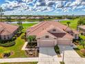 Beautiful aerial view of this home, showcasing the tile roof and landscaping at 5371 White Ibis Dr, North Port, FL 34287