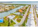 Aerial view showing waterfront home with circular driveway at 721 Binnacle Point Dr, Longboat Key, FL 34228