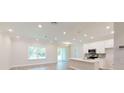 Bright and airy living room with hardwood floors and an open floor plan at 5113 Hablow Ln, North Port, FL 34286