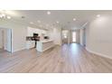 Open concept living area with tile flooring and island kitchen at 5113 Hablow Ln, North Port, FL 34286
