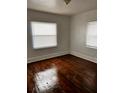 A bright bedroom with hardwood floors and two windows at 510 26Th St S, St Petersburg, FL 33712