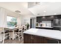 Modern kitchen with white countertops and dark cabinets at 9715 Harrell Ave # 40, Treasure Island, FL 33706