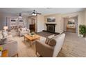 Spacious living room featuring hardwood floors and a fireplace at 272 Algiers Dr, Venice, FL 34293