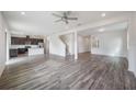 Spacious living room with hardwood floors and an open floor plan at 37488 Williamette Way, Zephyrhills, FL 33540