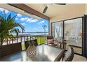 Spacious balcony with partial view of the bedroom and water views at 6268 Palma Del Mar S Blvd # 204, St Petersburg, FL 33715