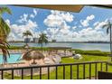 Stunning view of the pool and bay from a condo balcony at 6268 Palma Del Mar S Blvd # 204, St Petersburg, FL 33715