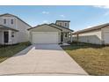 Charming single-Gathering home featuring a two-car garage, modern design, and freshly landscaped front yard at 14009 Crutchfield Ct, Parrish, FL 34219