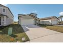Inviting single-Gathering home with a spacious driveway, two-car garage, and pristine front yard at 14009 Crutchfield Ct, Parrish, FL 34219