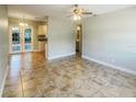Open concept dining area with tile flooring and access to the patio at 4185 Barracuda Se Dr, St Petersburg, FL 33705