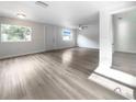 Bright living room features wood-look floors and an open floor plan at 1220 36Th W Ave, Bradenton, FL 34205