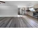 Open living room and kitchen with new flooring at 1220 36Th W Ave, Bradenton, FL 34205