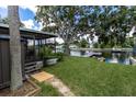 Screened porch overlooking the canal and dock at 14914 Capri Ln, Hudson, FL 34667