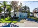 Quaint light blue home with small yard at 14914 Capri Ln, Hudson, FL 34667